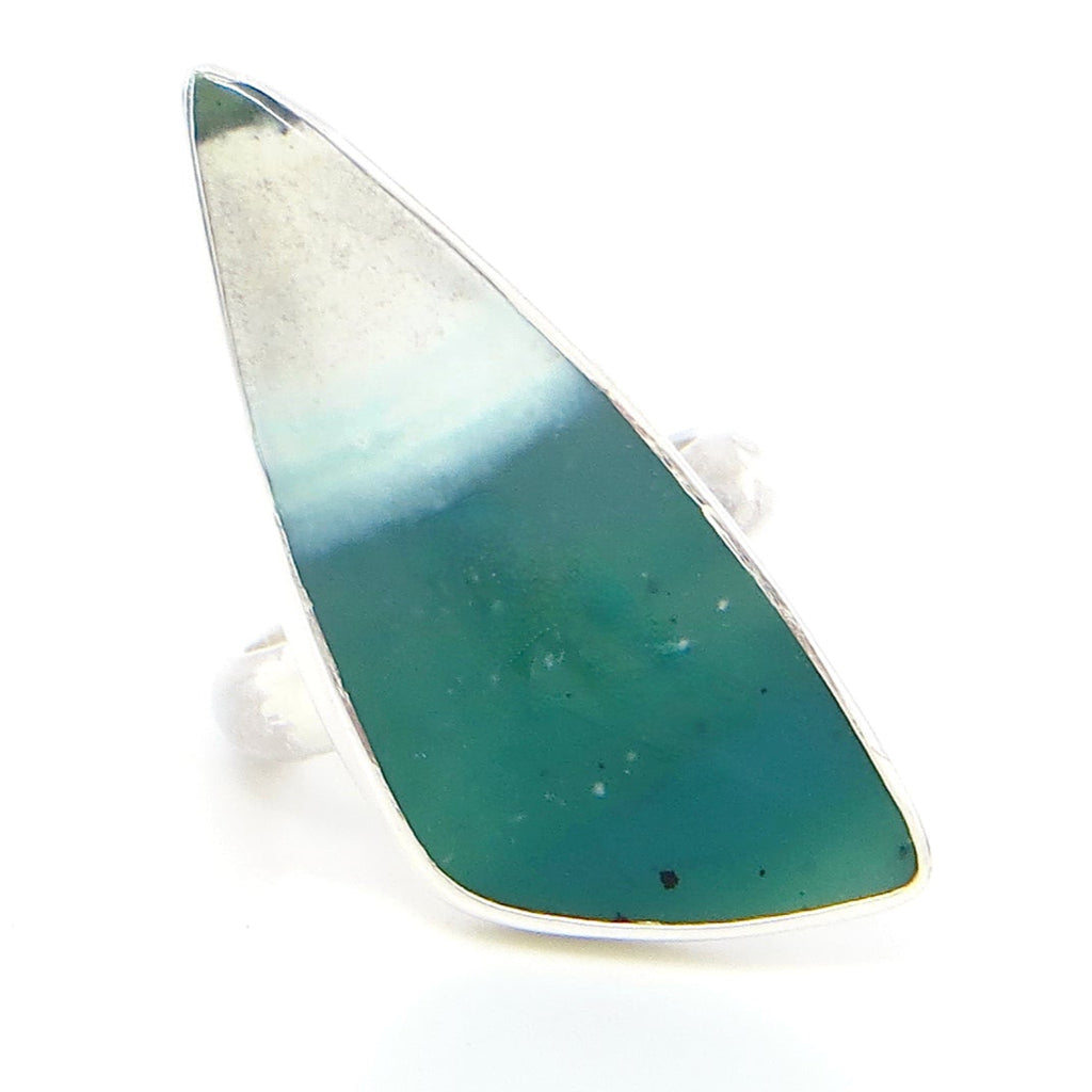 Triangular opalized petrified wood stone. Bezel set in fine silver bezel on sterling back and 1/2 round ring. Various greens, beige, and white. US size 7. Large stone makes a statement!