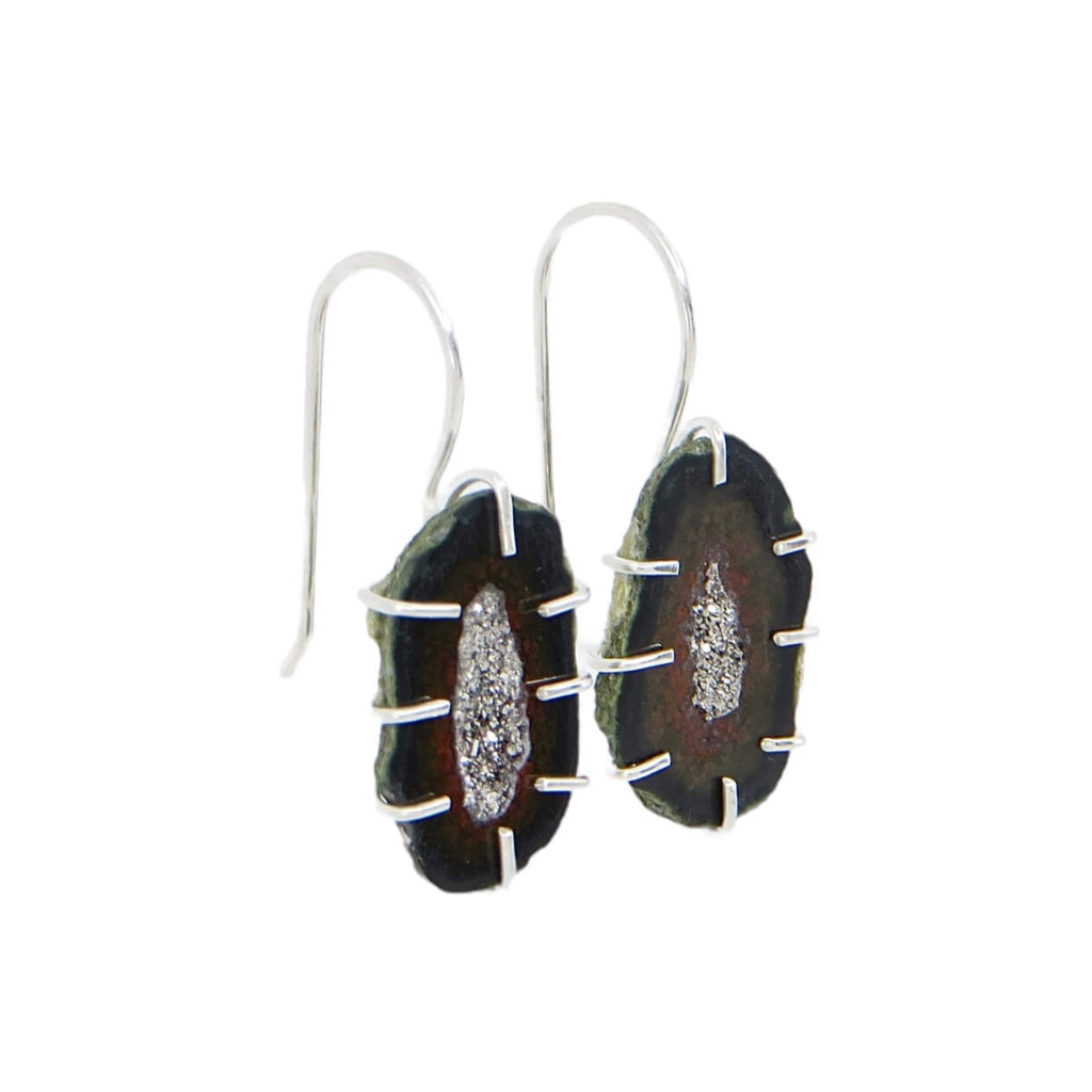 Mini split oval geodes with black, dark red, and speckle green outline.  Platinum coated interior crystals. Sterling cage prong settings with attached dangle ear wires.