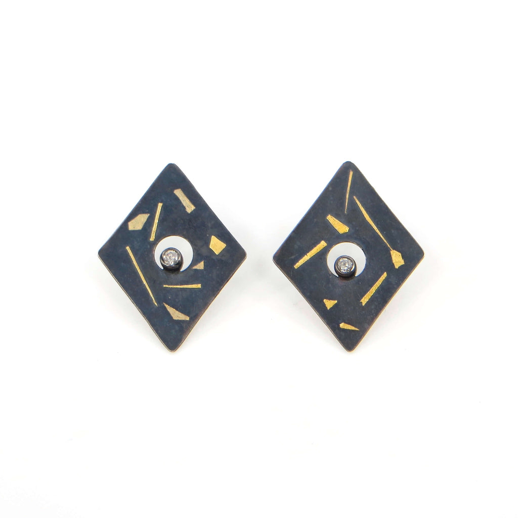 Sweet sparkling tiny diamonds in center of diamond shaped kaum-boo earrings. Black and gold with sparkling diamond. Post earrings.