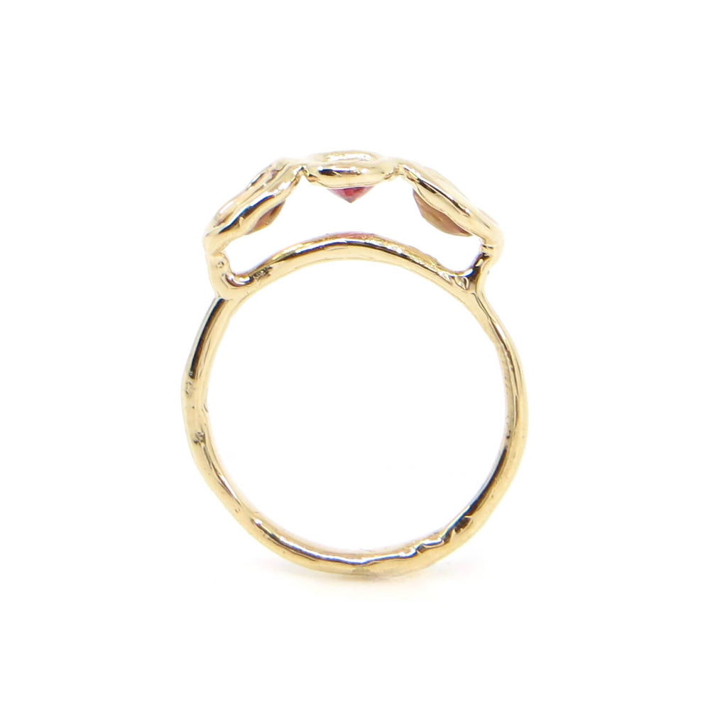 Gold and 3 oval sapphire ring. Peach side sapphires and center dark red sapphire. Organic feel shaped gold ring band and settings. Sapphires float above ring band. US size 5.5