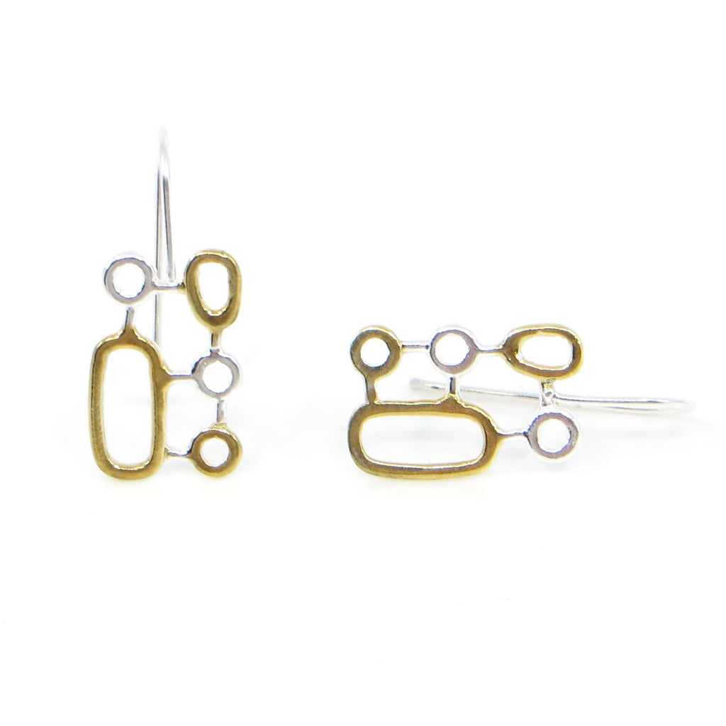 Organic geometrics earrings of sterling silver and 18k yellow gold plated on some of the shapes.