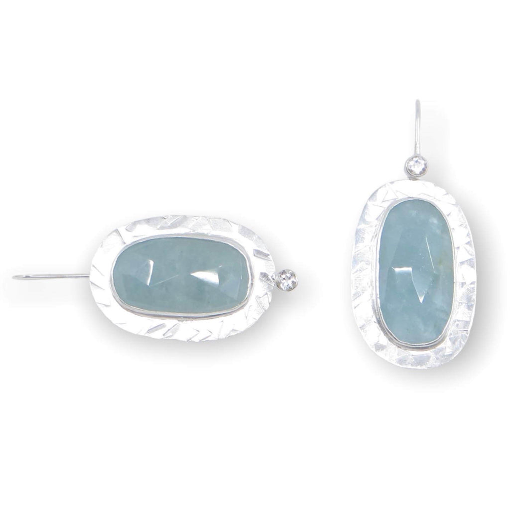 Oval rose cut aquamarines bezel set on faceted textured sterling silver.  Sparkling white tube set topaz accents on dangly earrings.