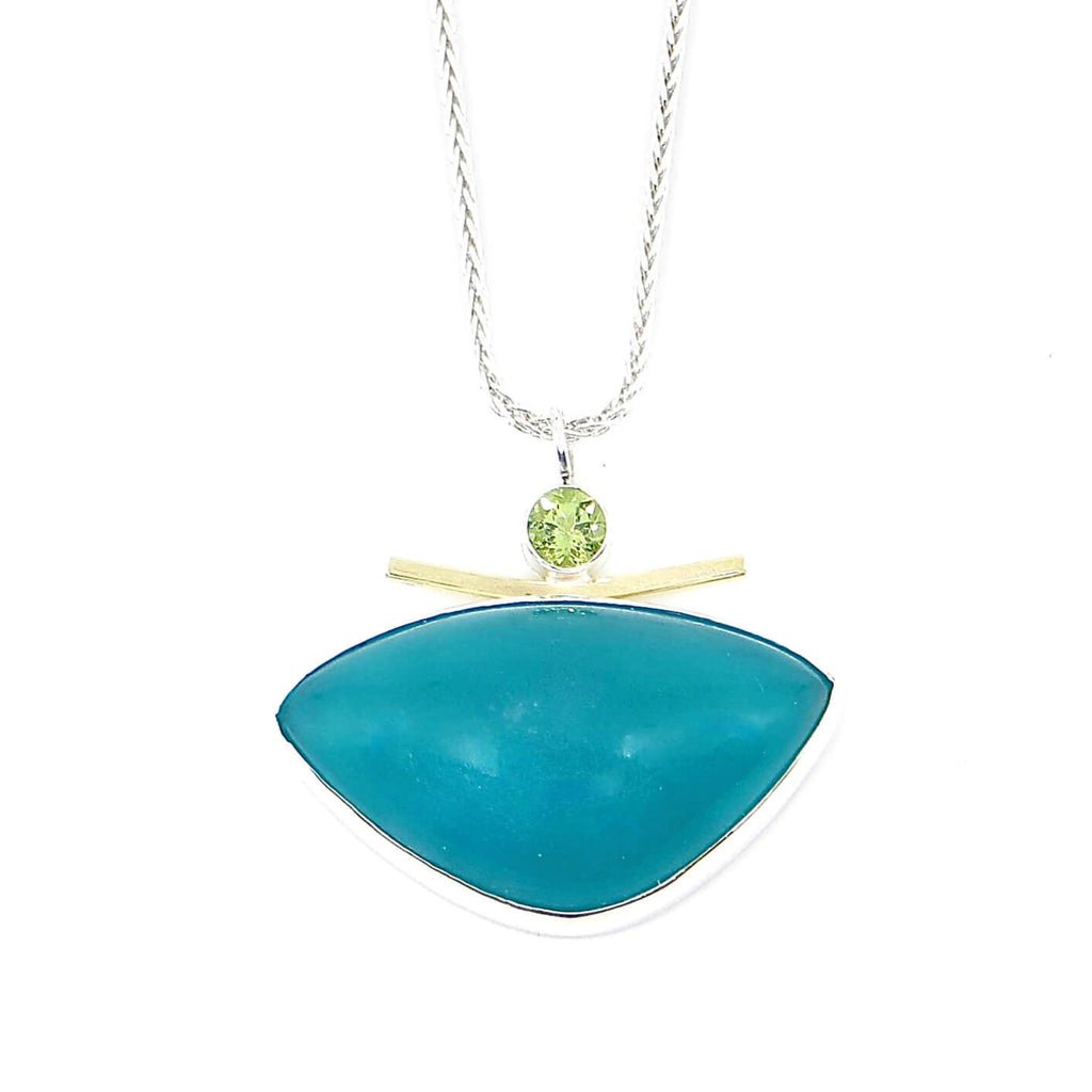 Rounded triangle amazonite pendant accented with gold square wire arc and round faceted peridot.  Sterling silver wheat chain 16"