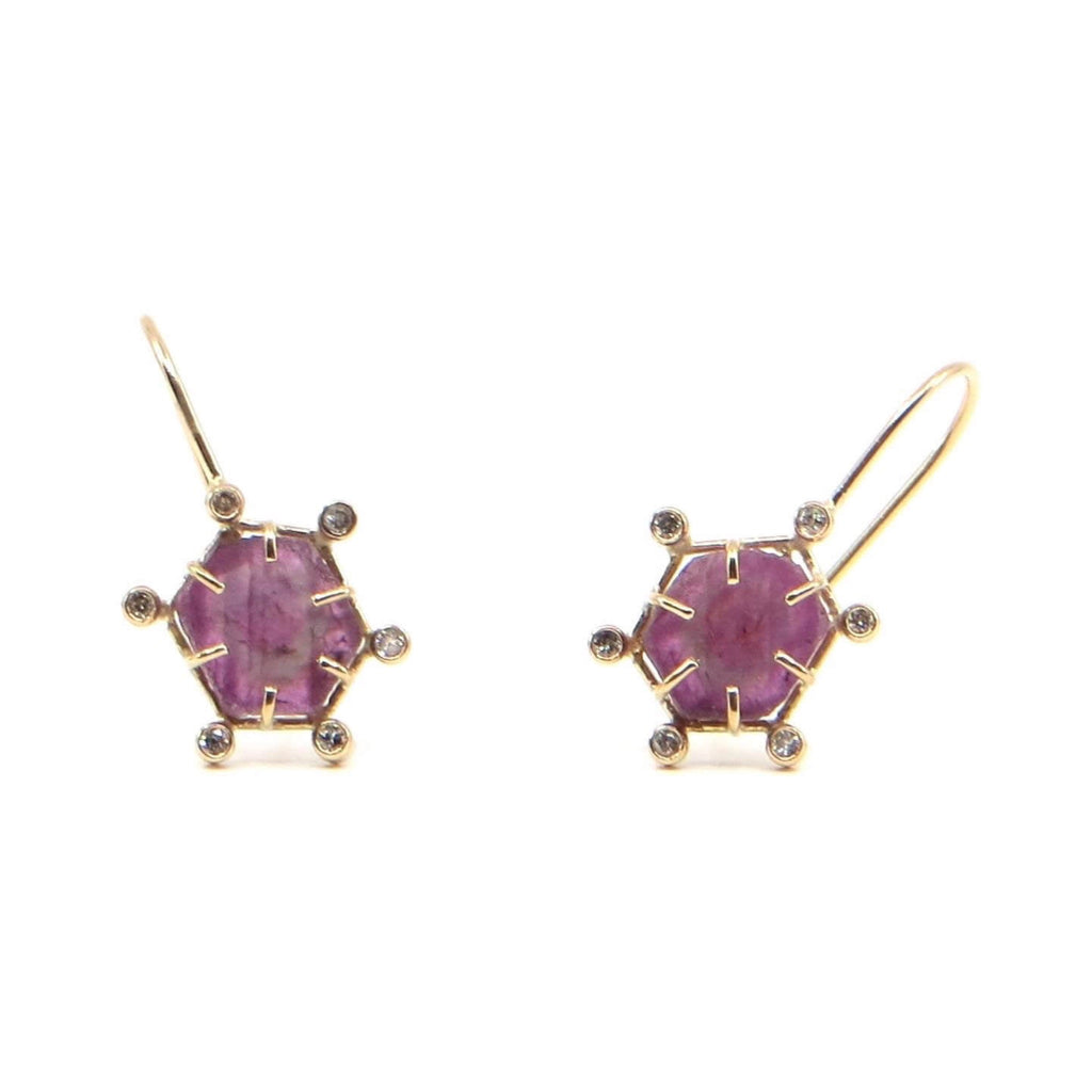 Hexagon ruby slices set in 14k gold frame settings. Tube set diamonds surround the frames with a diamond on each corner.  Fine contemporary dangle earrings.