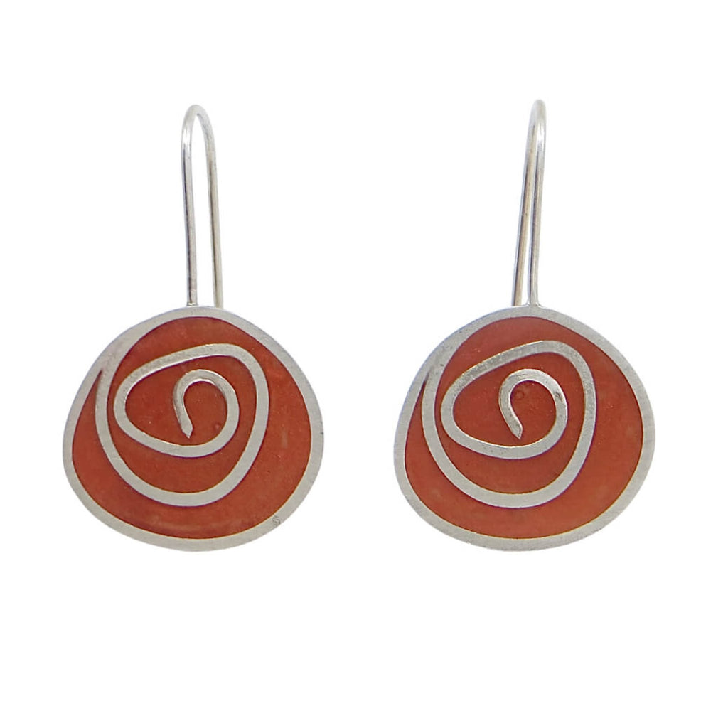 Sterling silver swirls earrings with rust color pigmented resin.