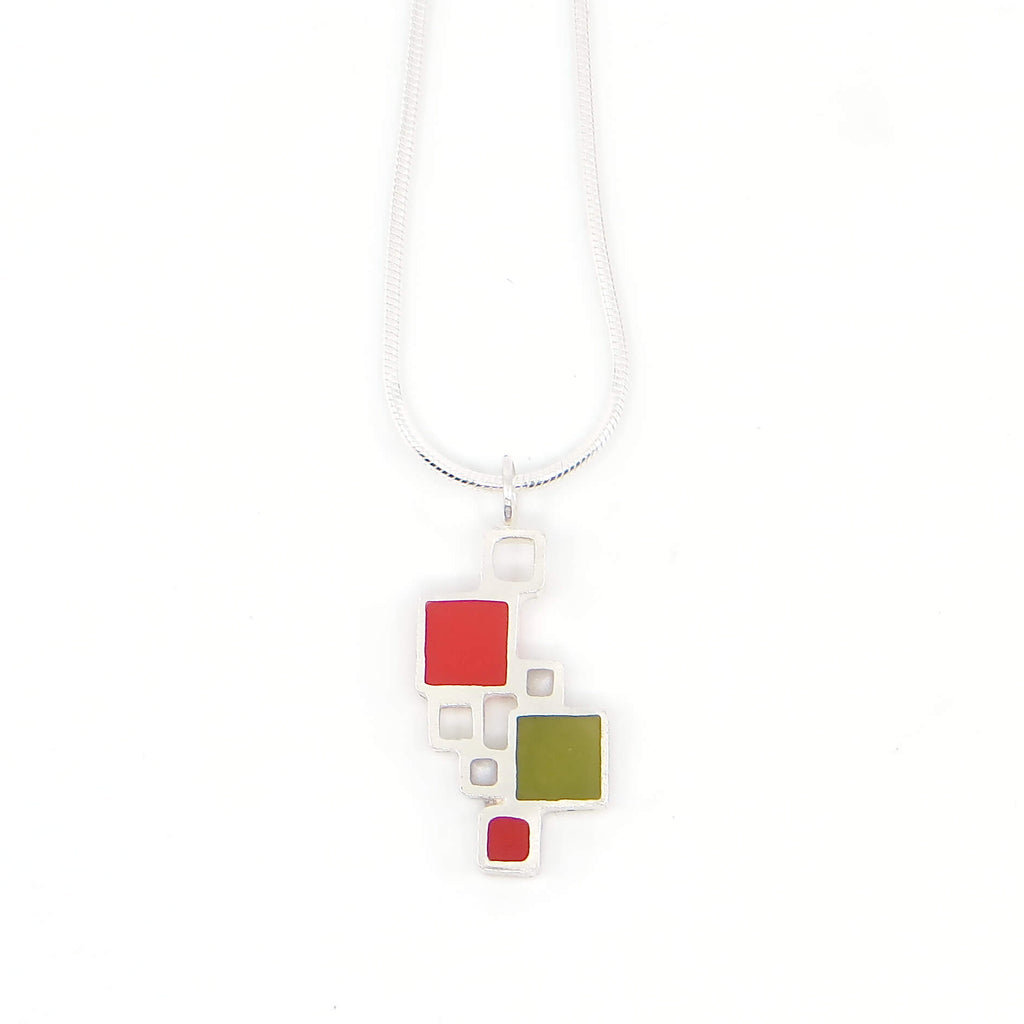Sterling silver open squares with pigmented resin inlay in some of them . Red. White. Olive green. Sterling snake chain. Pendant 1" long. 16" chain.