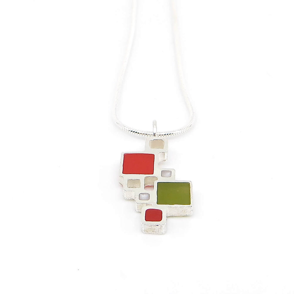 Sterling silver open squares with pigmented resin inlay in some of them . Red. White. Olive green. Sterling snake chain. Pendant 1" long. 16" chain.