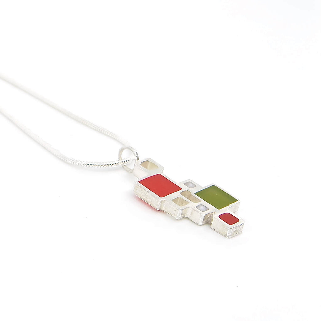 Sterling silver open squares with pigmented resin inlay in some of them . Red. White. Olive green. Sterling snake chain. Pendant 1" long. 16" chain.