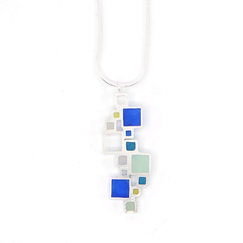 Sterling silver open squares with pigmented resin inlay in some of them . Blue. Teal. Seafoam green. Apple green. Sterling snake chain. Pendant 1.5" long. 16" chain.