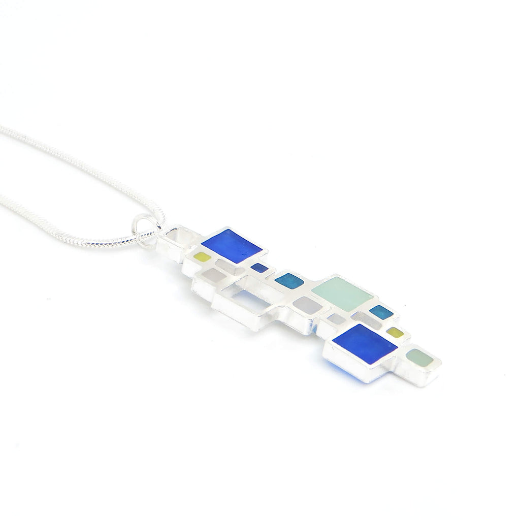 Sterling silver open squares with pigmented resin inlay in some of them . Blue. Teal. Seafoam green. Apple green. Sterling snake chain. Pendant 1.5" long. 16" chain.
