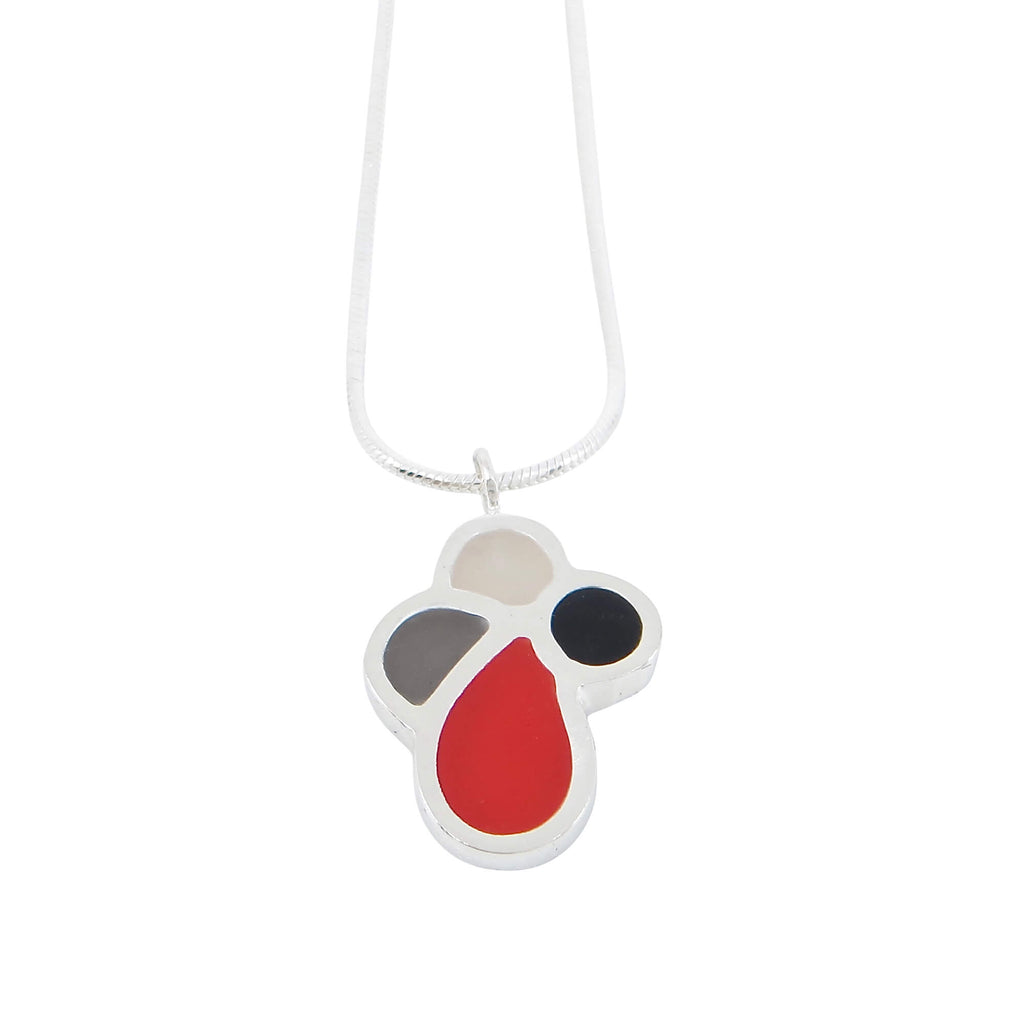 Flora! 4 component sterling silver petal pendant filled with sanded resin inlay. Red, white, black, grey. 16" sterling snake chain.