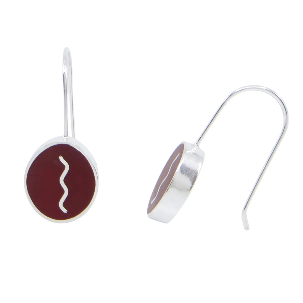 Sterling silver chunky oval dangle earrings. Vertical silver squiggle surrounded by maroon resin inlay.