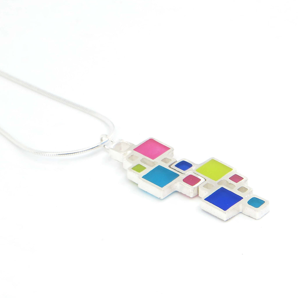 Sterling silver necklace of various sized squares. Some open, some filled with color. Geometric.