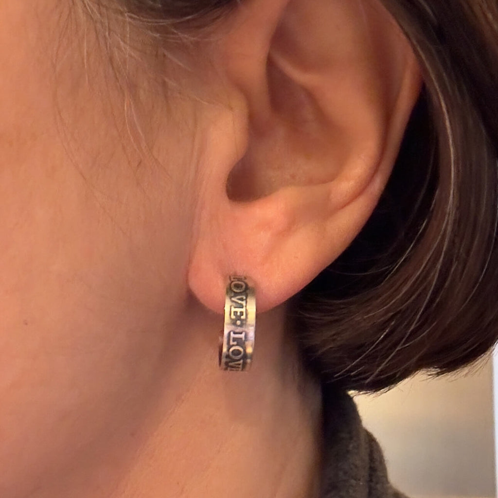 Earring shown on ear for scale.