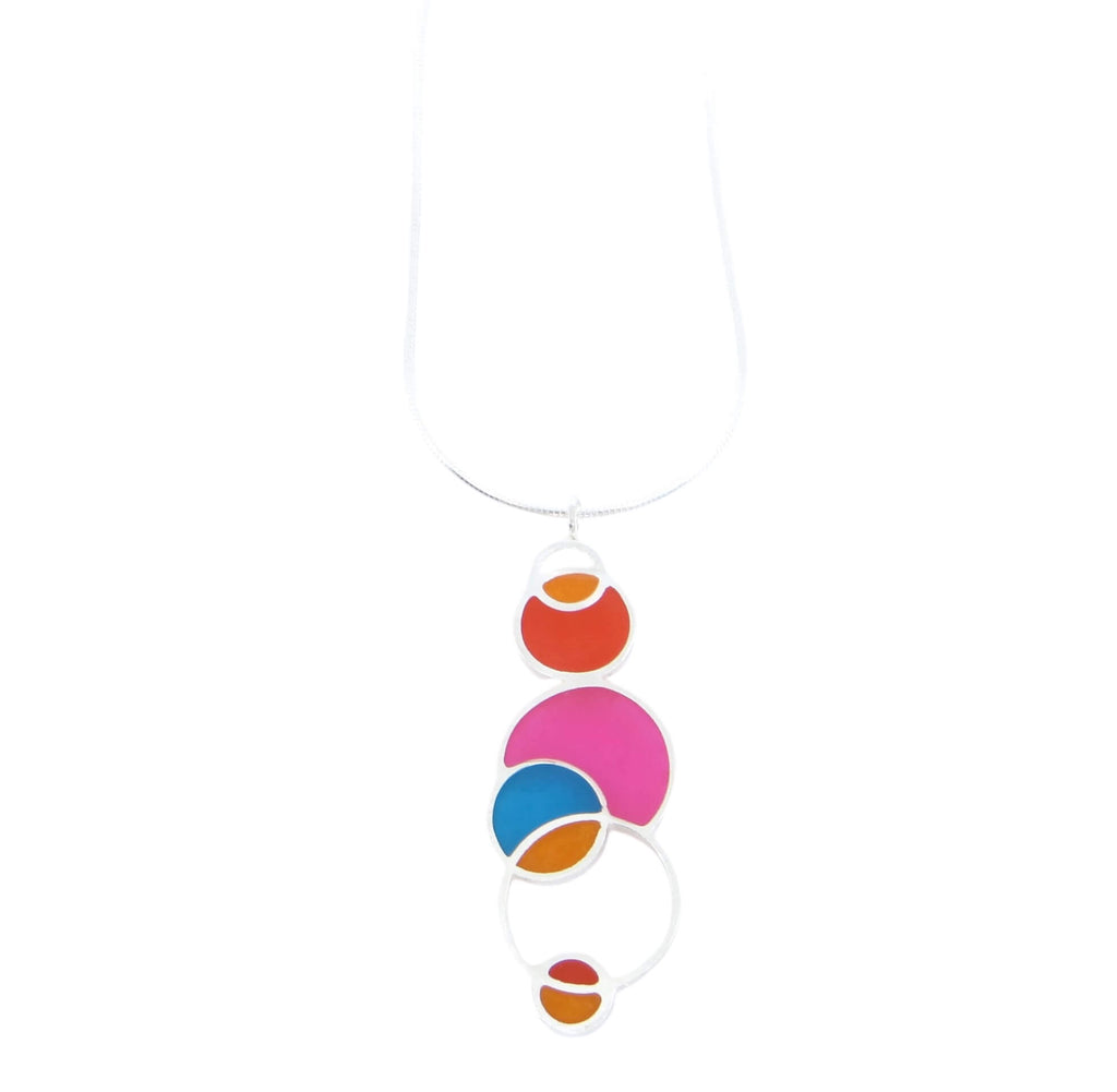 Open circles pendant. Sterling silver and pigmented resin. Sterling 16" snake chain. Pink, dark orange, orange, aqua. Matte finish one side, shiny other side.