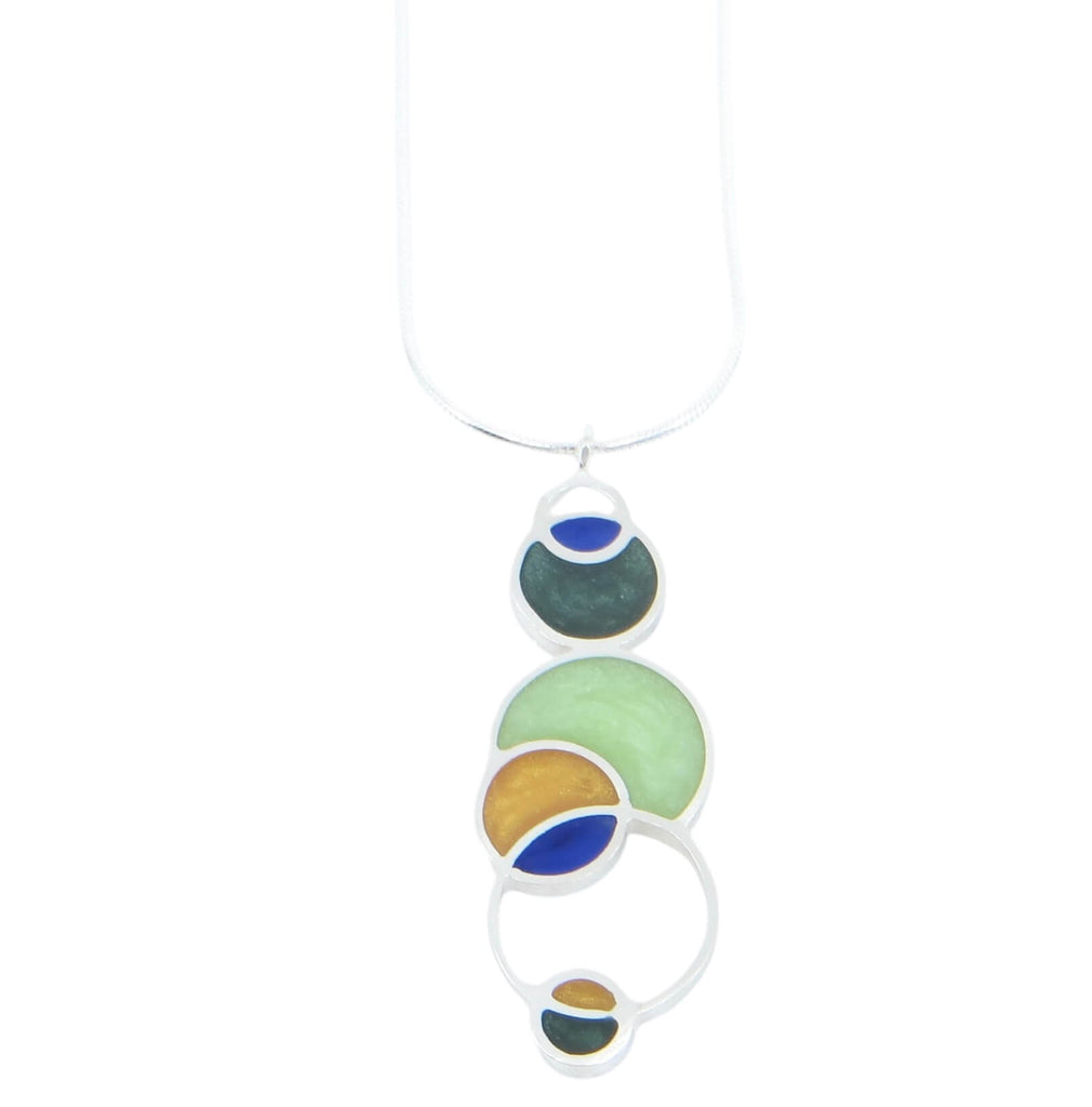 Open circles pendant. Sterling silver and pigmented resin. Sterling 16" snake chain. Blue, dark green, light green, maize.. Matte finish one side, shiny other side.