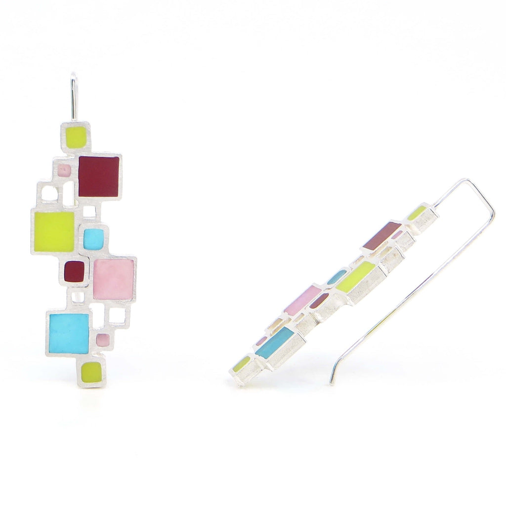 Sterling open squares earrings with an architectural look. Some squares filled with pigmented resin, others open space. Apple green, teal, blue, and turquoise make for vibrant, Mondrian-like earrings.
