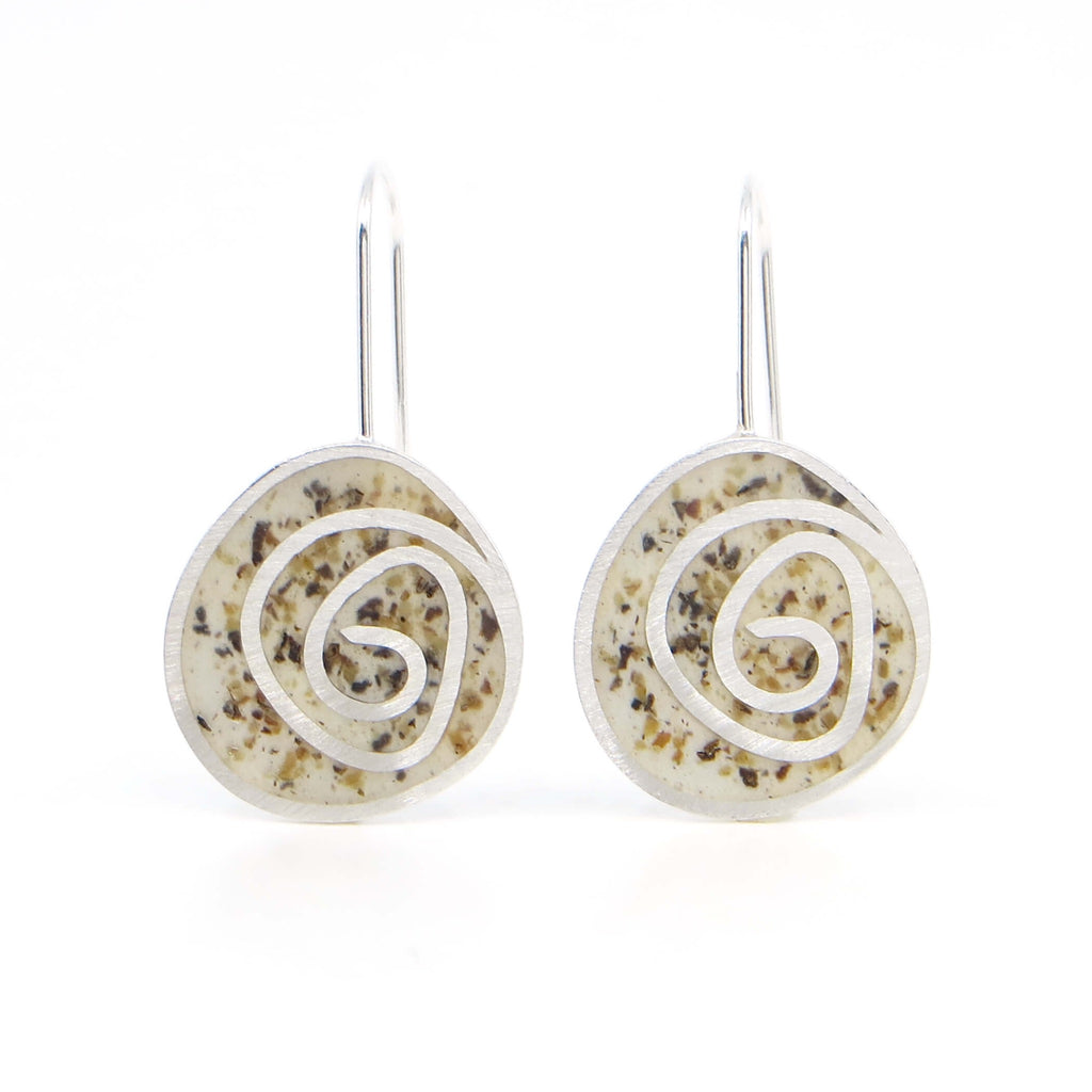 Sterling silver dangle earrings with swirl pattern.  Resin pigmented with black pepper fills the receptacles between the swirl pattern and is sanded down flush with the silver.