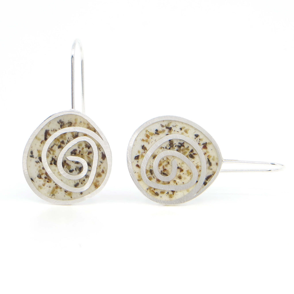 Sterling silver dangle earrings with swirl pattern.  Resin pigmented with black pepper fills the receptacles between the swirl pattern and is sanded down flush with the silver.