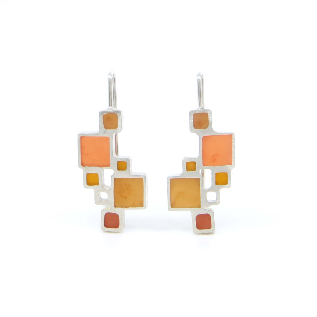 Sterling open squares earrings with square hooked earlier have pigmented resin inlay in some squares. Pumpkin orange, brick red, and golden make lovely autumn colored earrings. Mondrian-like.