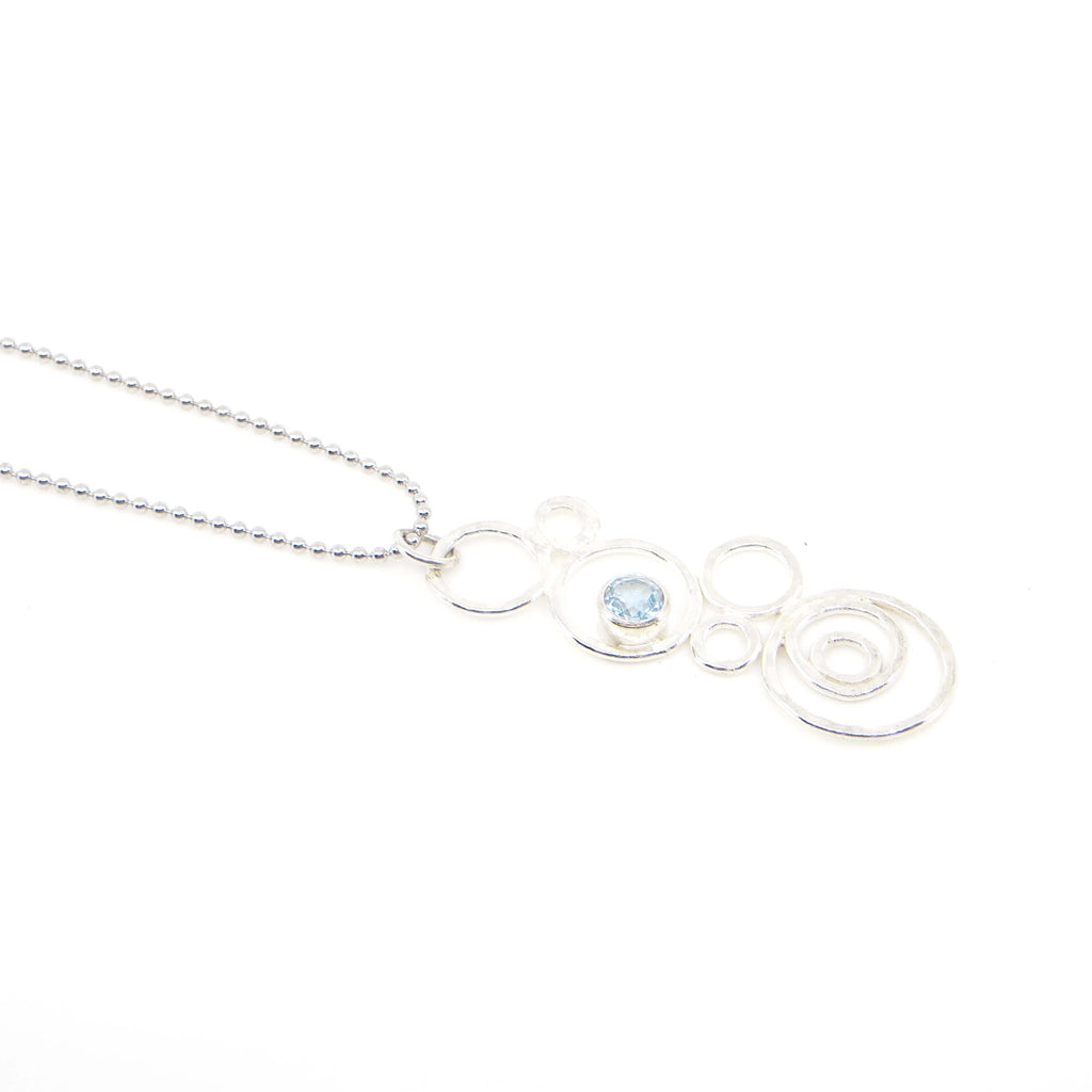 Hammered argentium silver circles-bubbles-of different sizes pendant with 3.5 mm tube set sky blue topaz. Bubblescence necklace. Sterling bead chain.