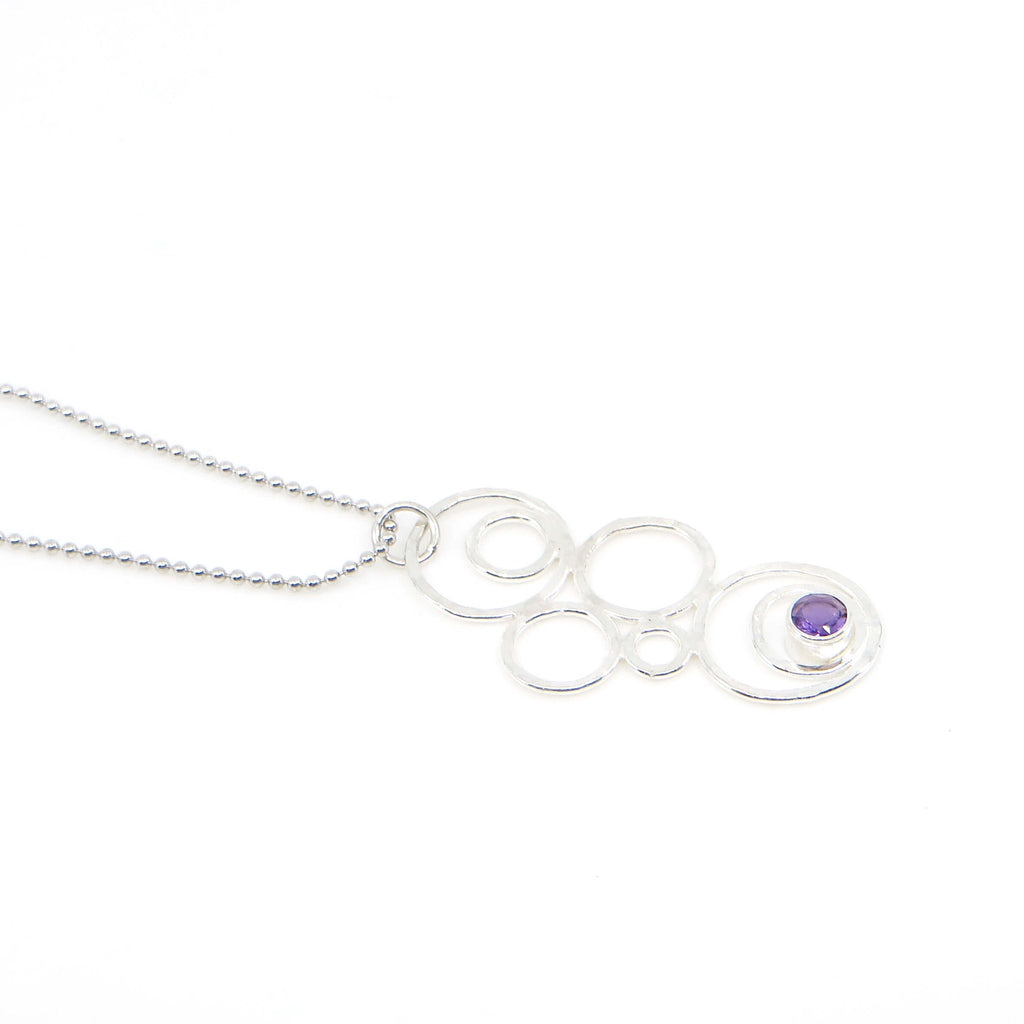 Hammered argentium silver circles-bubbles-of different sizes pendant with 3.5 mm tube set amethyst. Bubblescence necklace. Sterling bead chain.