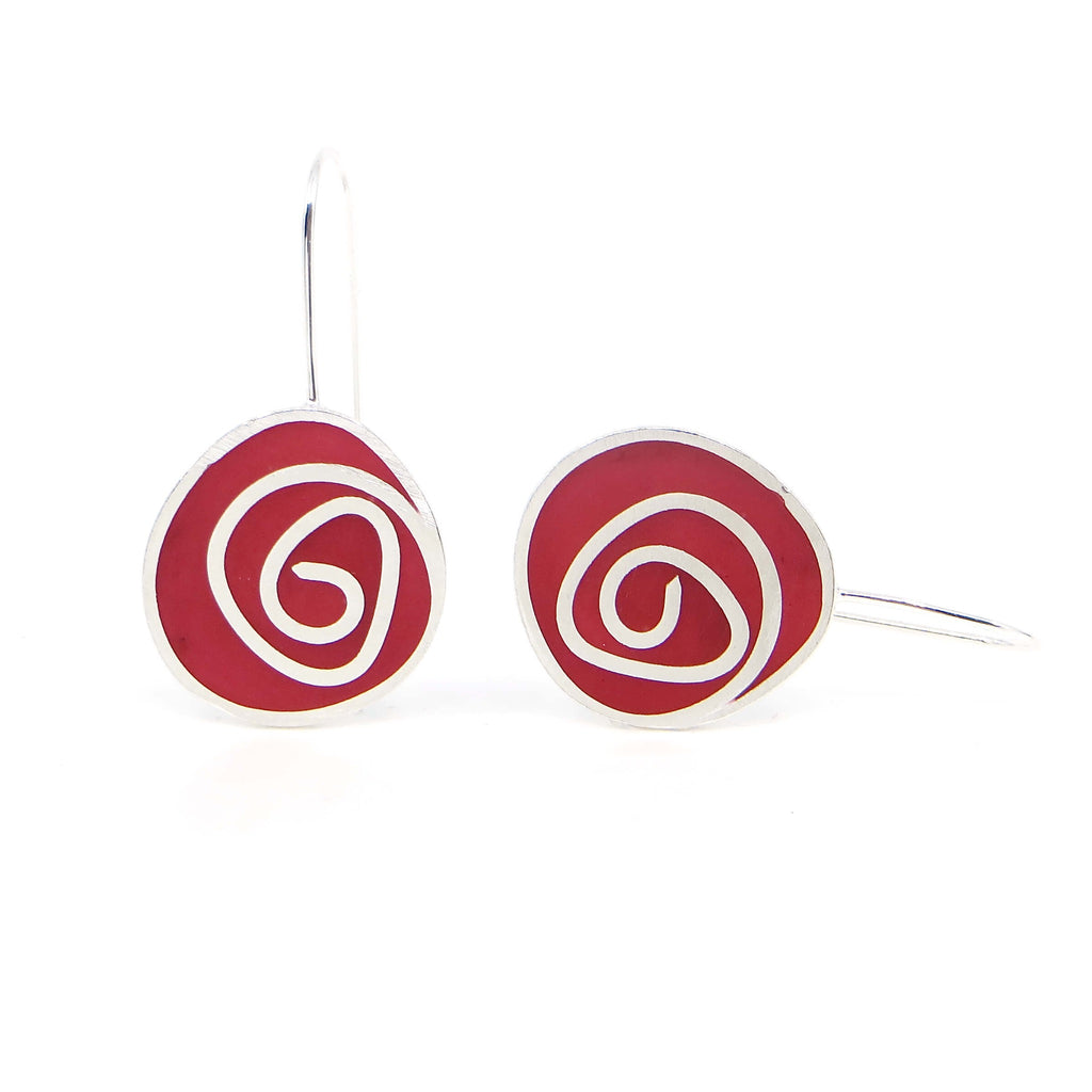 Sterling silver swirls dangle earrings with maroon pigmented resin inlay. Color pops for the ears!