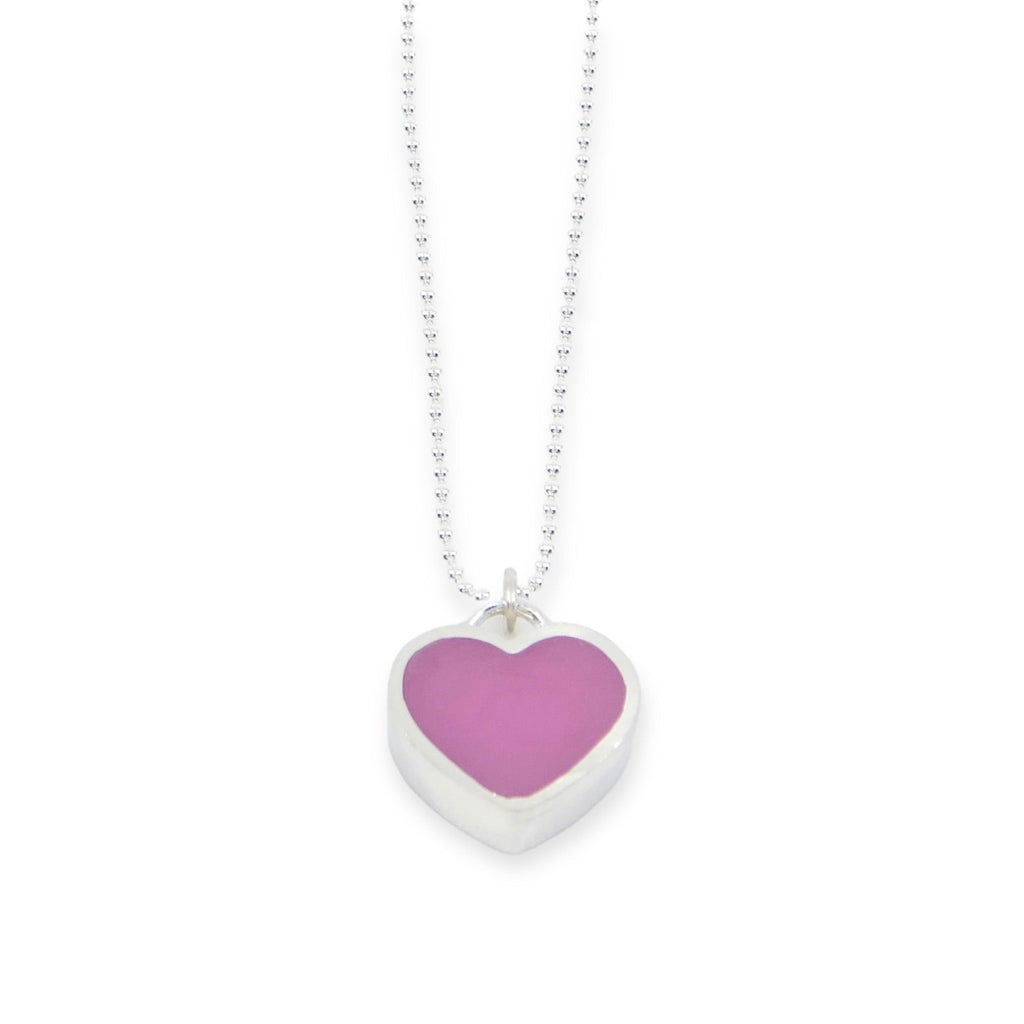 A "candy" heart pendant. A sterling silver heart frames richly colored pigmented resin to form a chunky little candy heart that hangs from a sterling silver bead chain. Heart is .5" Choice of 16" or 18" chain. Pink