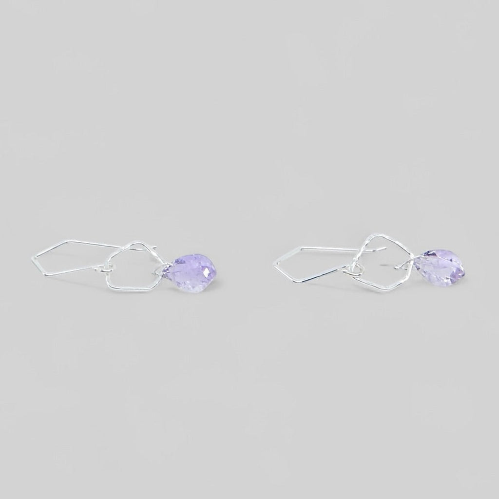 Cool angular amethysts hang from hammered sterling silver angled pentagon components. The ear wires have angles to complement the dangle earrings.