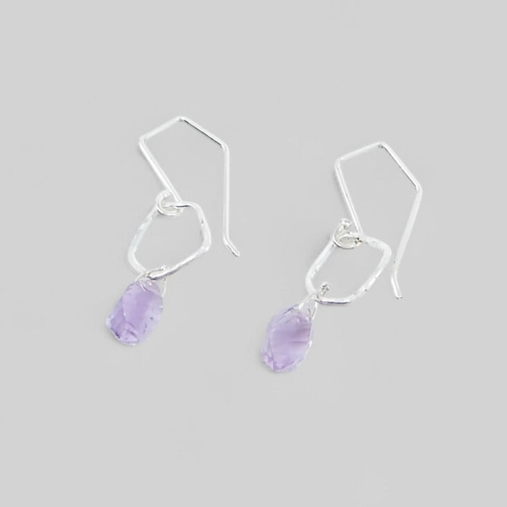 Cool angular amethysts hang from hammered sterling silver angled pentagon components. The ear wires have angles to complement the dangle earrings.