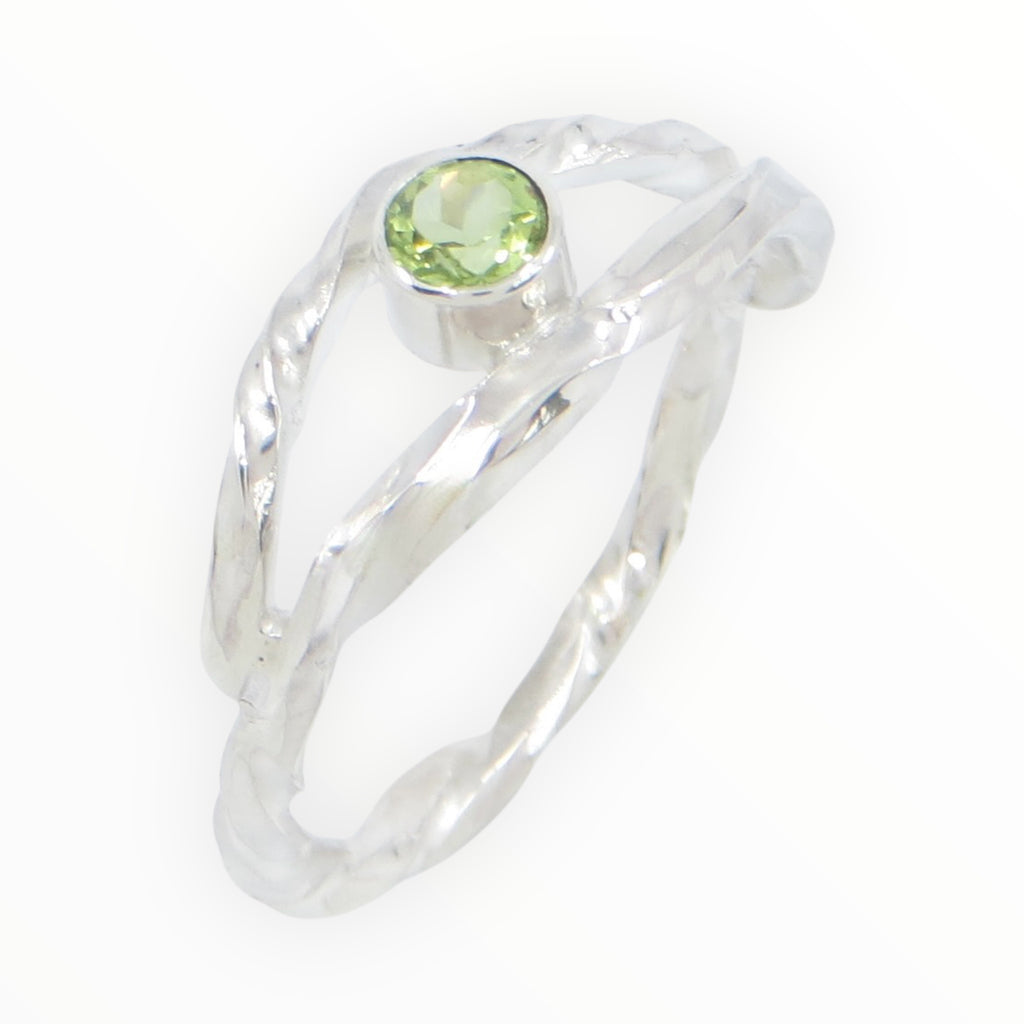 Twisted square wire sterling silver ring with the band creating an open marquis shape that hugs a tube set peridot in the center. 4mm round peridot. US Size 8. 