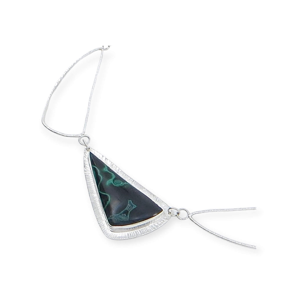 Curved triangle malachite pendant bezel set on chisel textured backing. Chisel textured complementary sterling silver links form the necklace that features the malachite front and center. The clasp is fabricated to match the triangular links. 17"