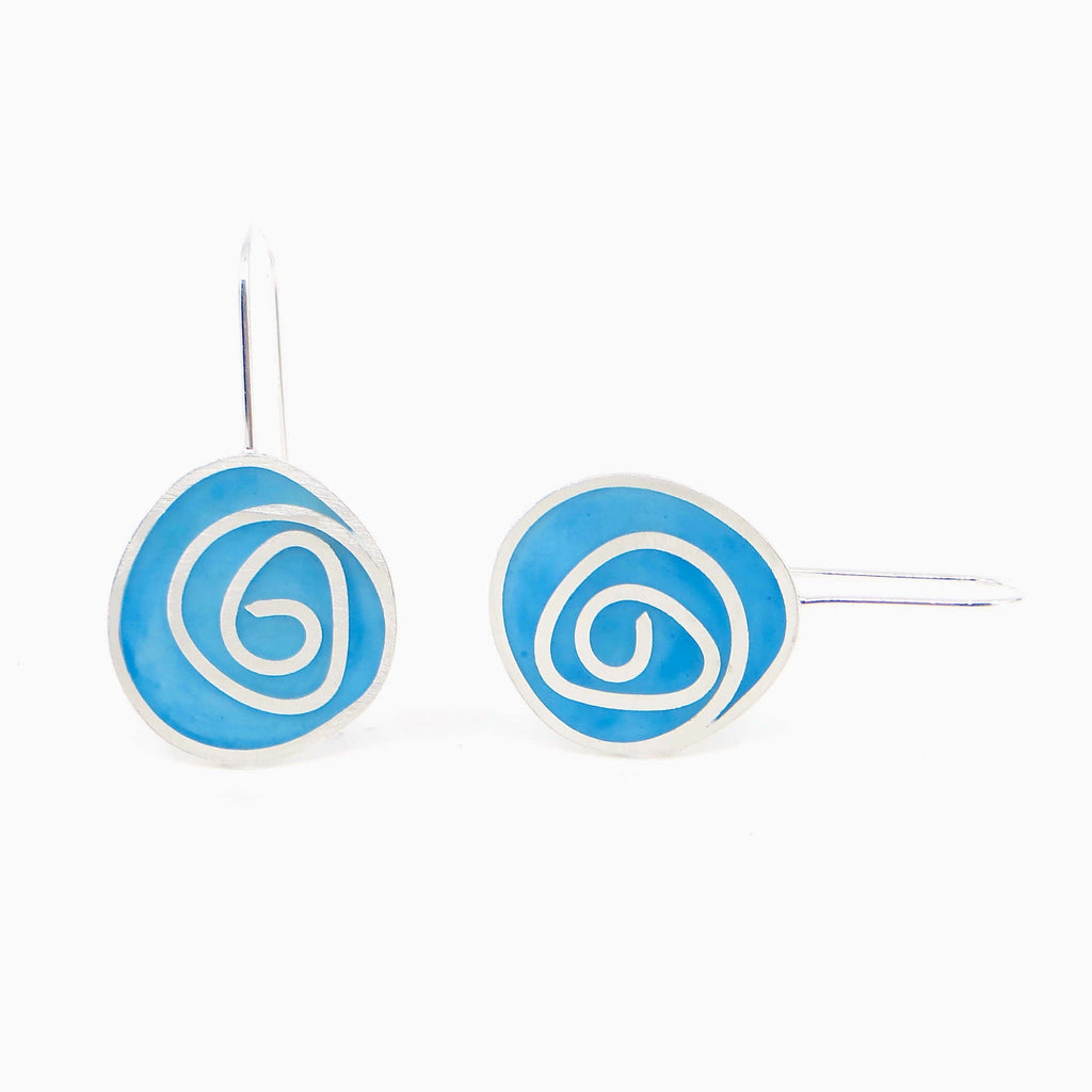 Sterling silver swirls dangle earrings with turquoise pigmented resin inlay. Color pops for the ears!