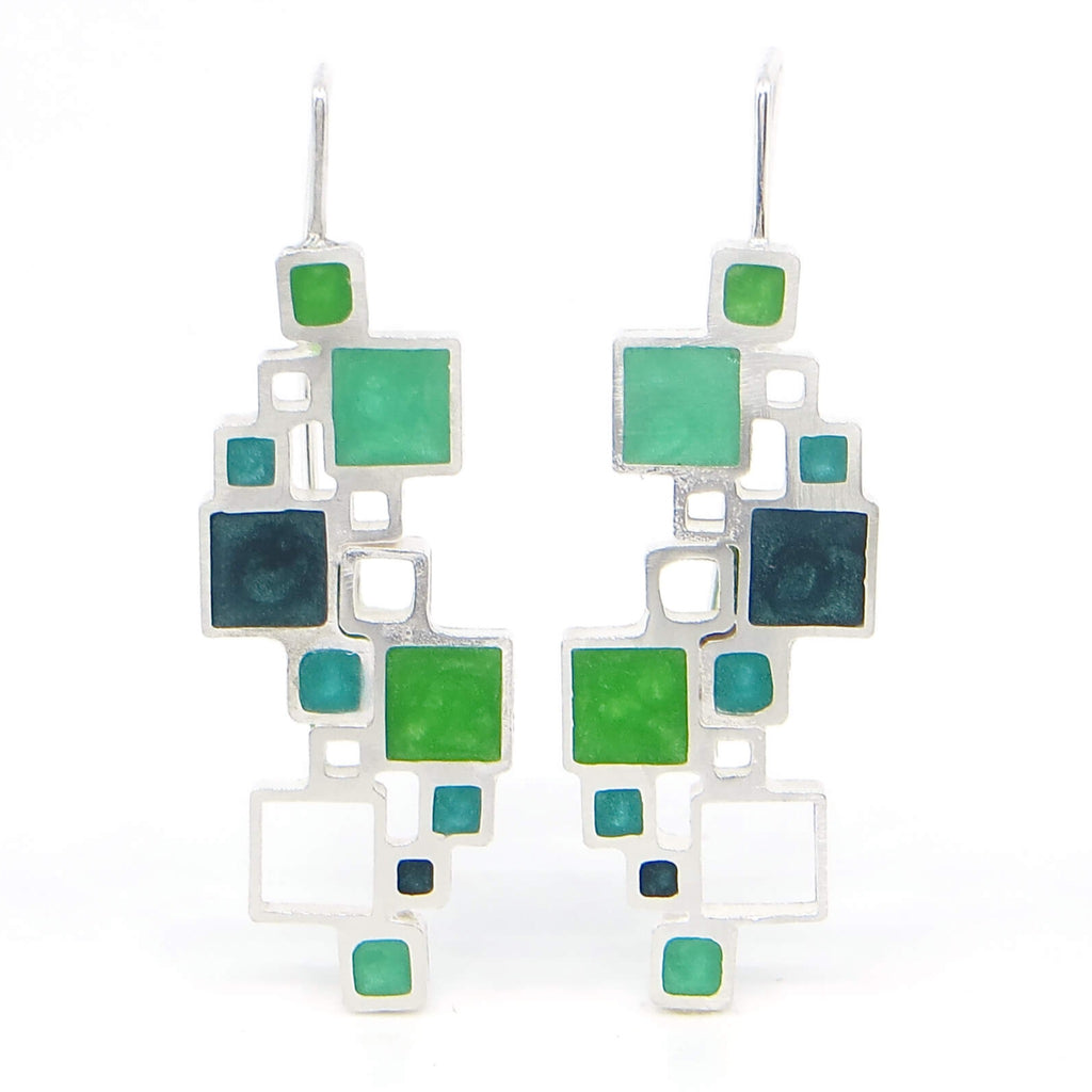 Sterling silver and pigmented resin inlay earrings. All different sized squares, some filled with resin, some open air. 4 different shades of green. Architectural.