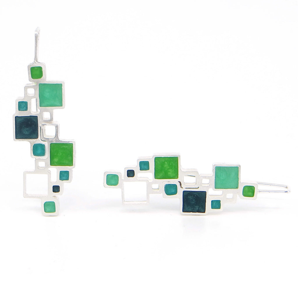 Sterling silver and pigmented resin inlay earrings. All different sized squares, some filled with resin, some open air. 4 different shades of green. Architectural.
