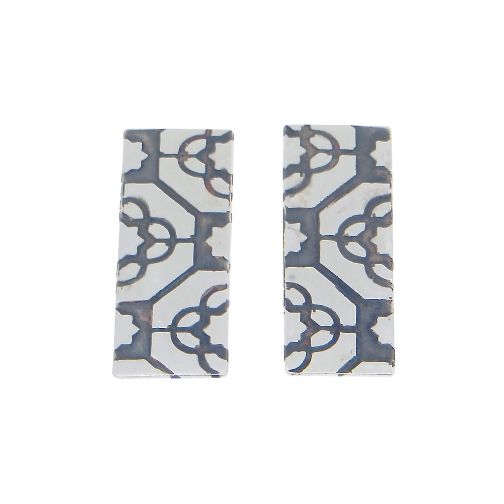 Etched rectangle sterling silver post earrings. Geometric pattern with black patina to highlight the pattern and provide a nice contrast to the silver. Edgy. Fine. Contemporary. Great with casual and dressy attire.