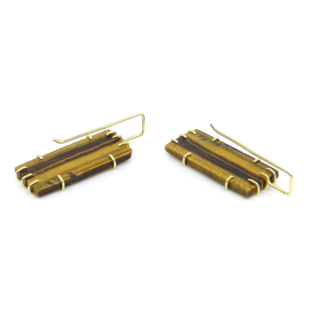 Rectangular Tigers Eye tiles with vertical golden and brown stripes set in 18k gold front cage prongs Stripes of gold in front over the stones with square angles ear wire hooks to complement stone angles.