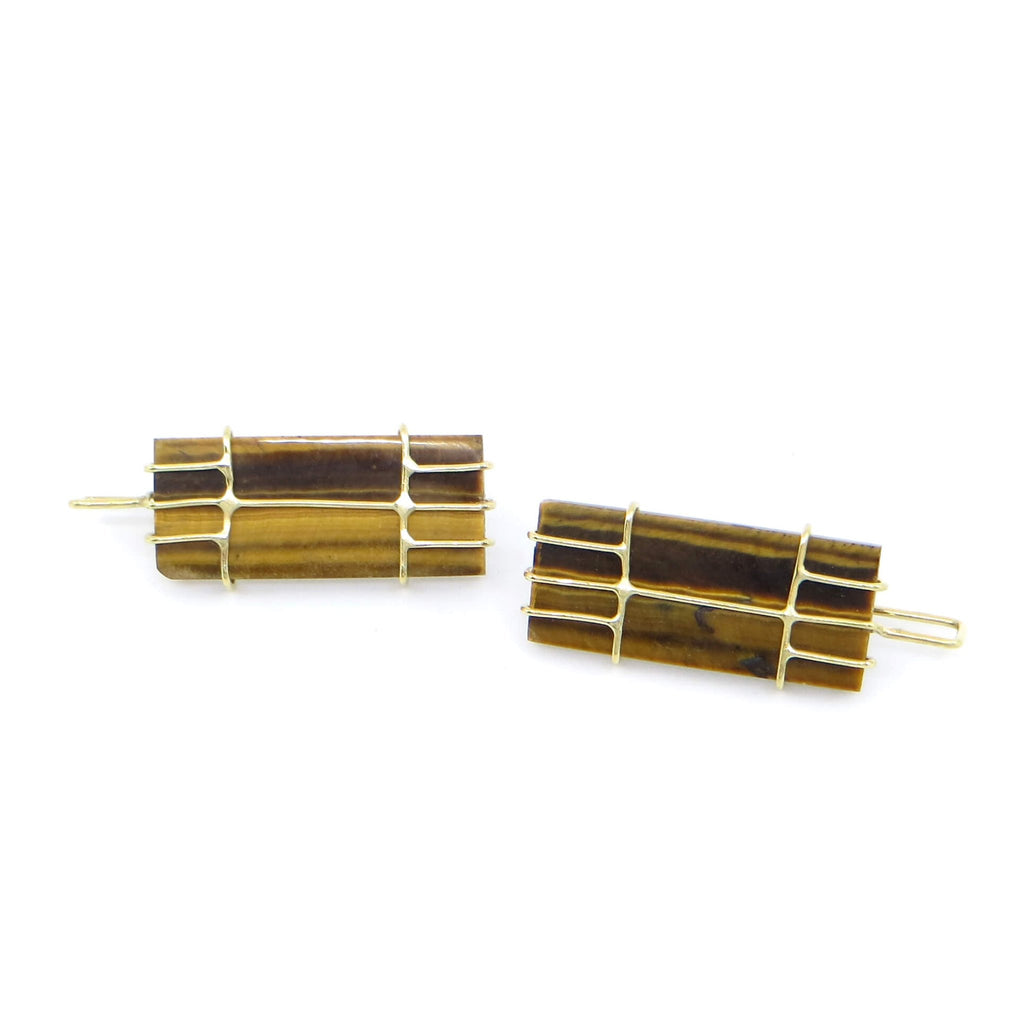 Rectangular Tigers Eye tiles with vertical golden and brown stripes set in 18k gold front cage prongs Stripes of gold in front over the stones with square angles ear wire hooks to complement stone angles.