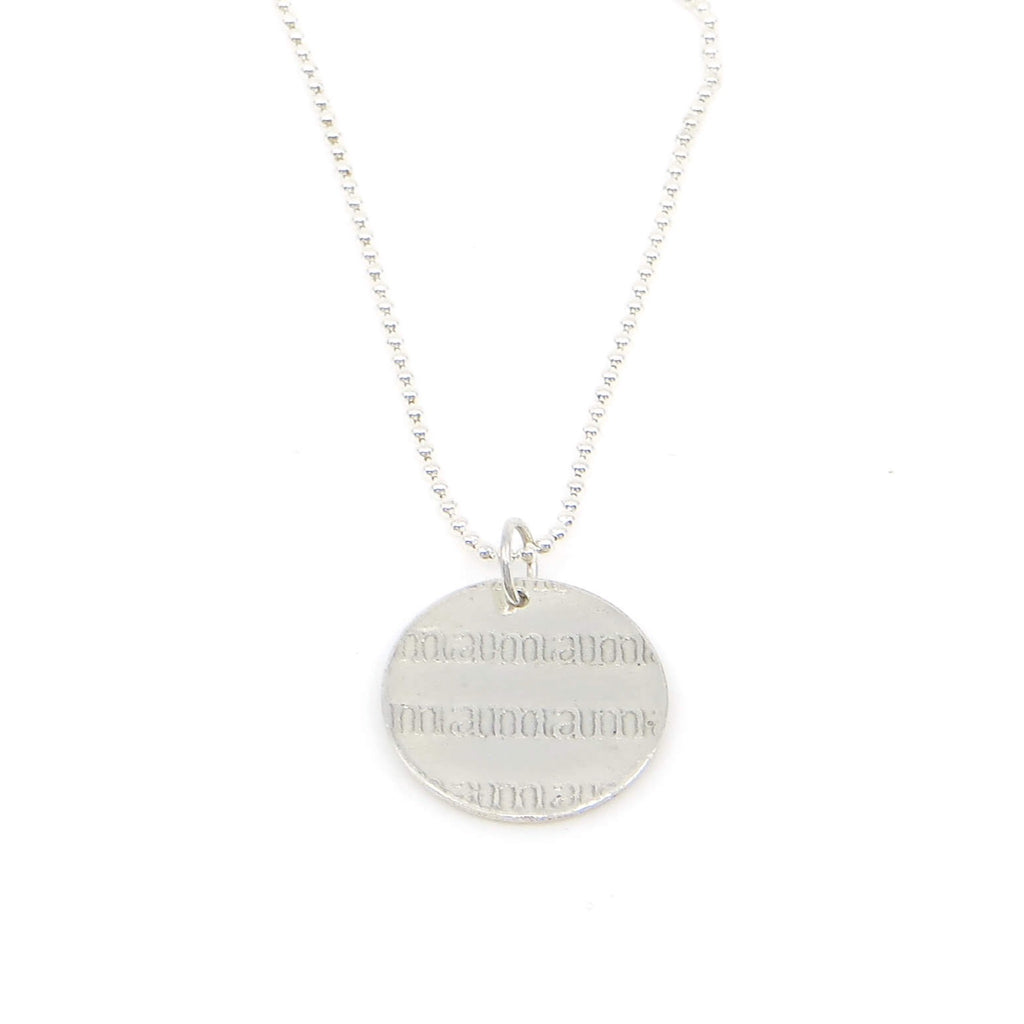 Rows of raised text saying mamamamama  on a 5/8" disc sterling silver pendant hanging on a 16" sterling bead chain.