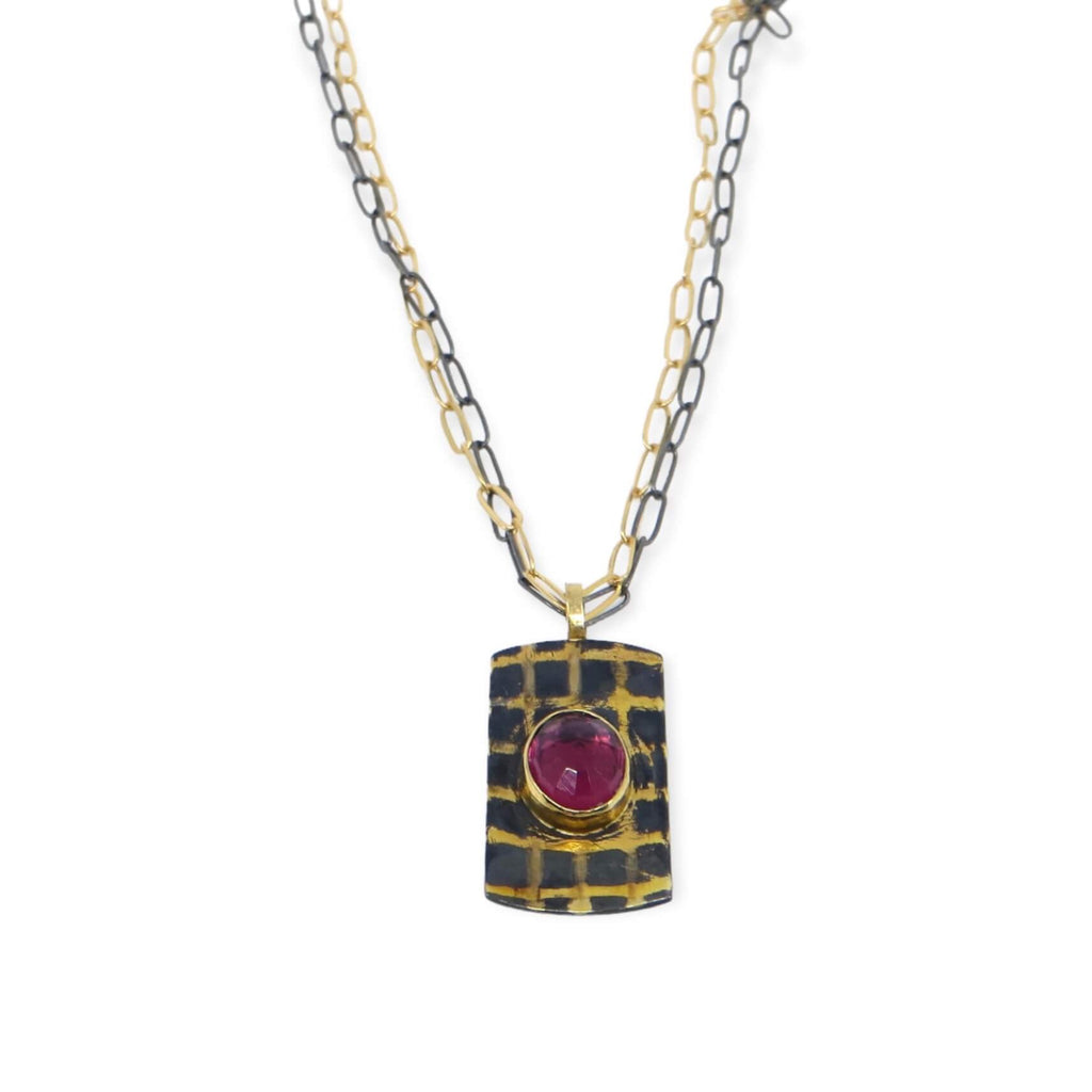 Gold and black grid pendant with rose cut oval garnet. 18k royal yellow gold bail, 18k gold grid, 14k gold bezel. Gold and black chains.