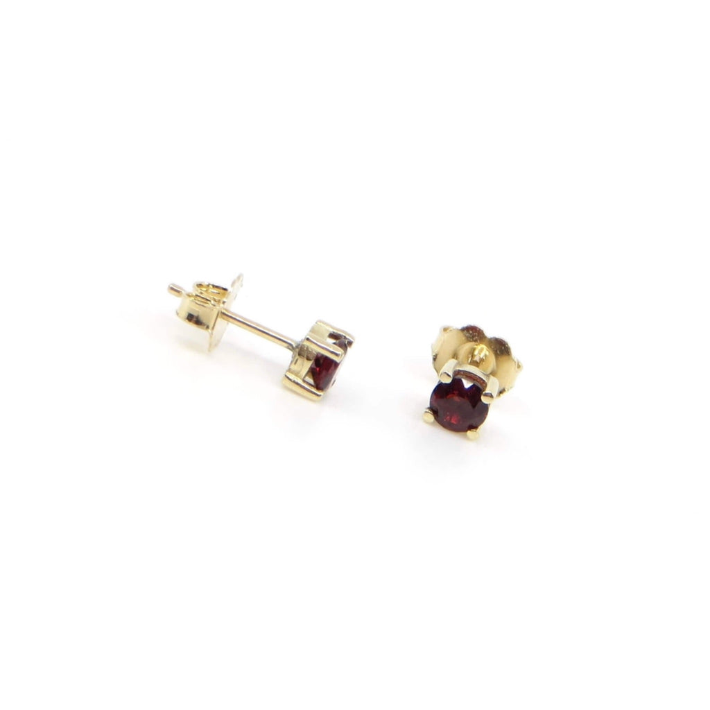 14k gold and round  garnet contemporary classic 4 prong set stud earrings.
