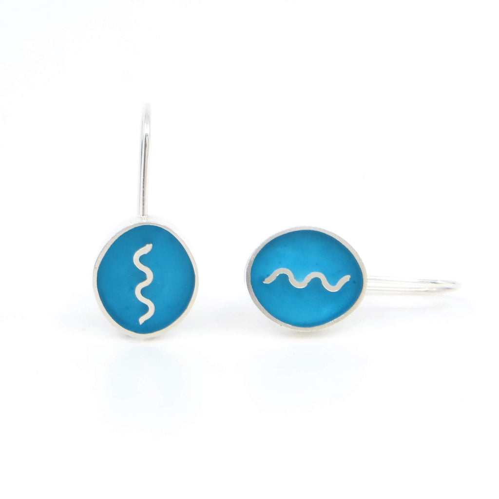 Sterling silver oval earrings with vertical sterling squiggle. Turquoise resin inlay.