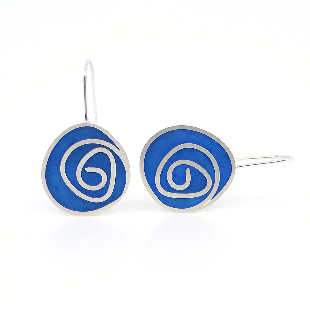 Sterling silver and blue pigmented resin inlay swirl earrings.