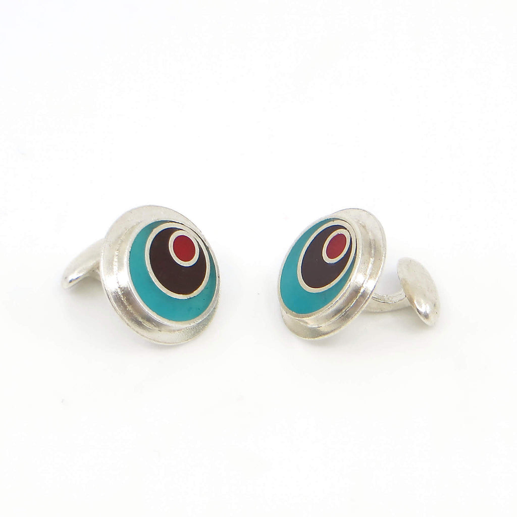 Sterling silver and resin inlay off target cufflinks.  Turquoise outer ring, chocolate brown middle ring, red dot.